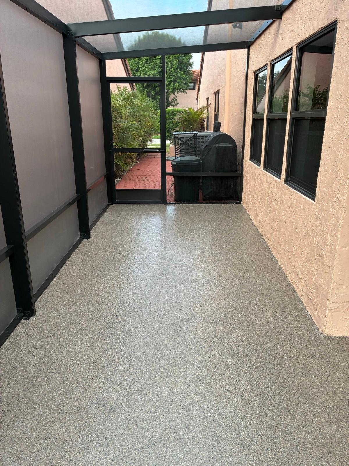 Epoxy patio walkway coating with flake finish installed by Resin Masters in Delray Beach, FL