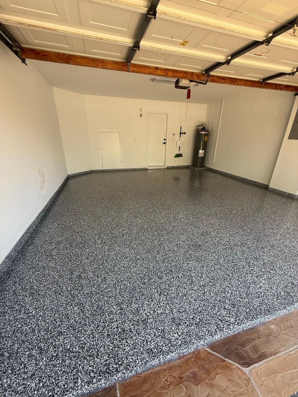 Decorative full flake epoxy garage floor after installation by Resin Masters in Delray Beach, FL