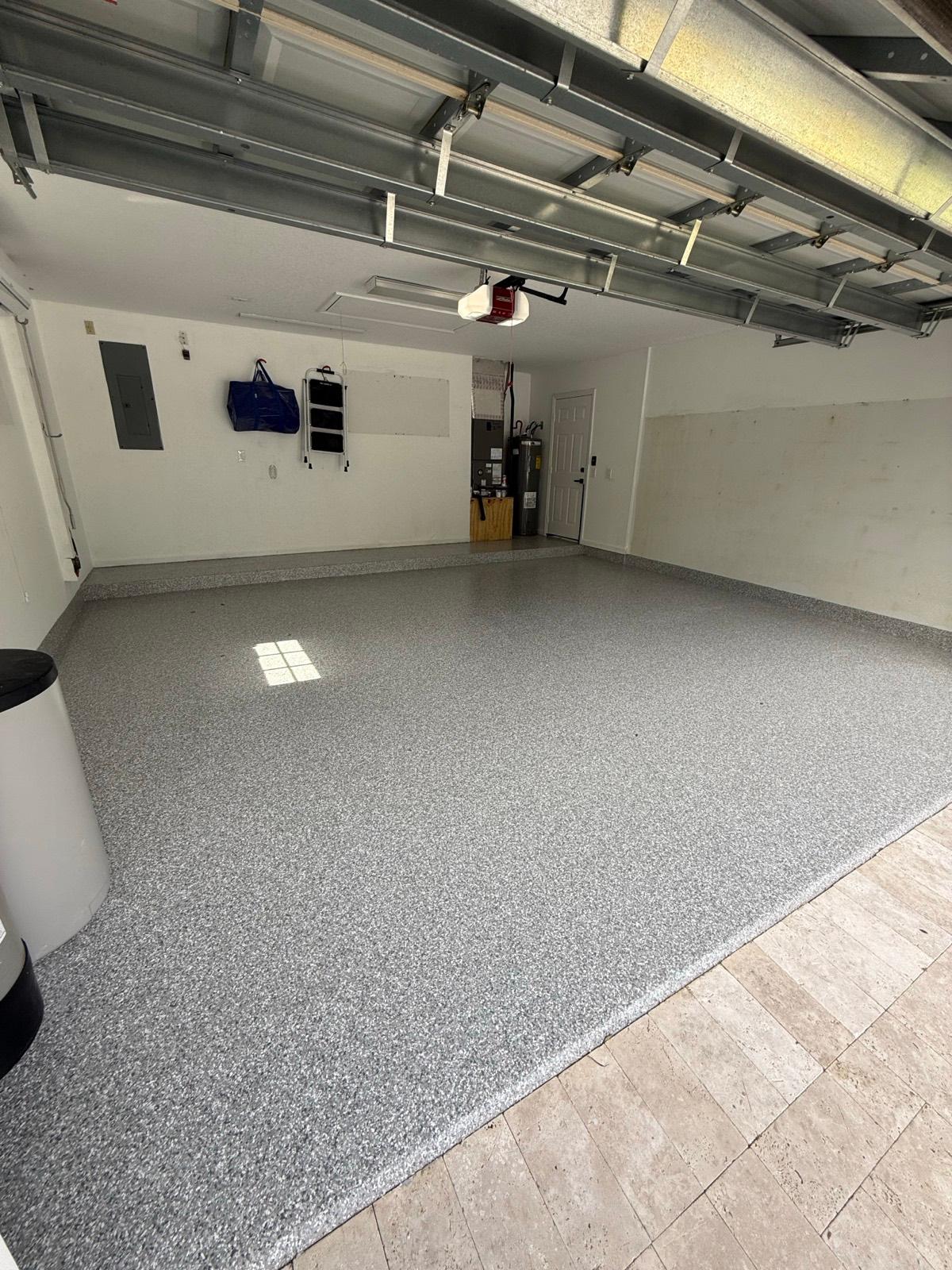 Gray full flake epoxy garage floor installed by Resin Masters in Boynton Beach, FL