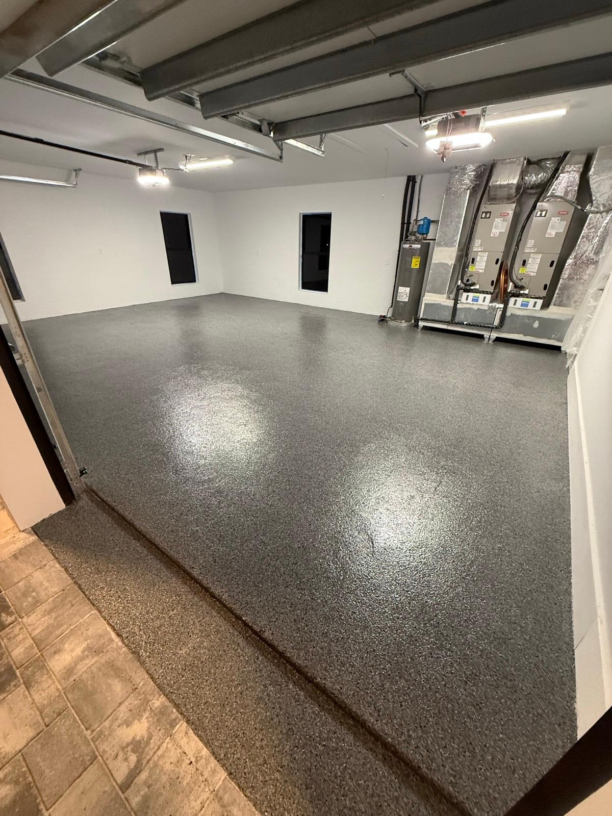 Glossy full flake epoxy garage floor coating installed by Resin Masters in West Palm Beach, FL