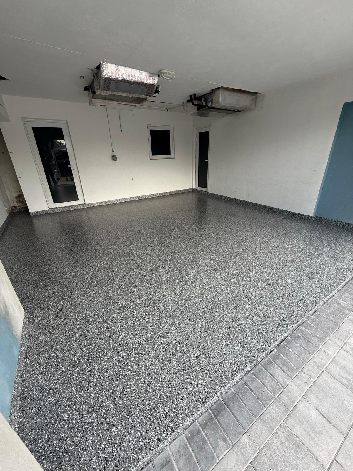 Durable full flake epoxy garage floor coating installed by Resin Masters in Palm Beach Gardens, FL
