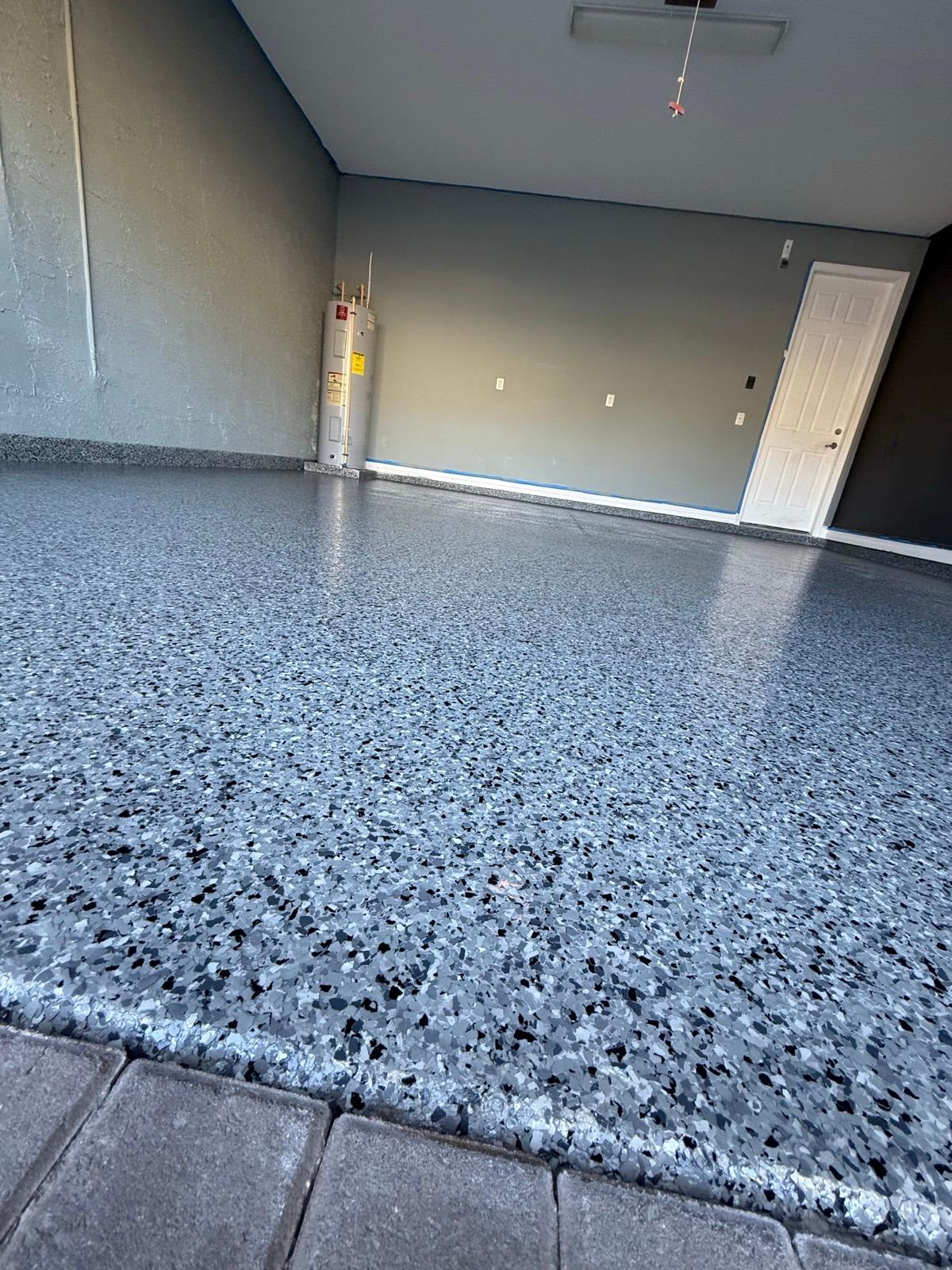 Edge detail of full flake epoxy garage floor coating installed by Resin Masters in Lighthouse Point, FL
