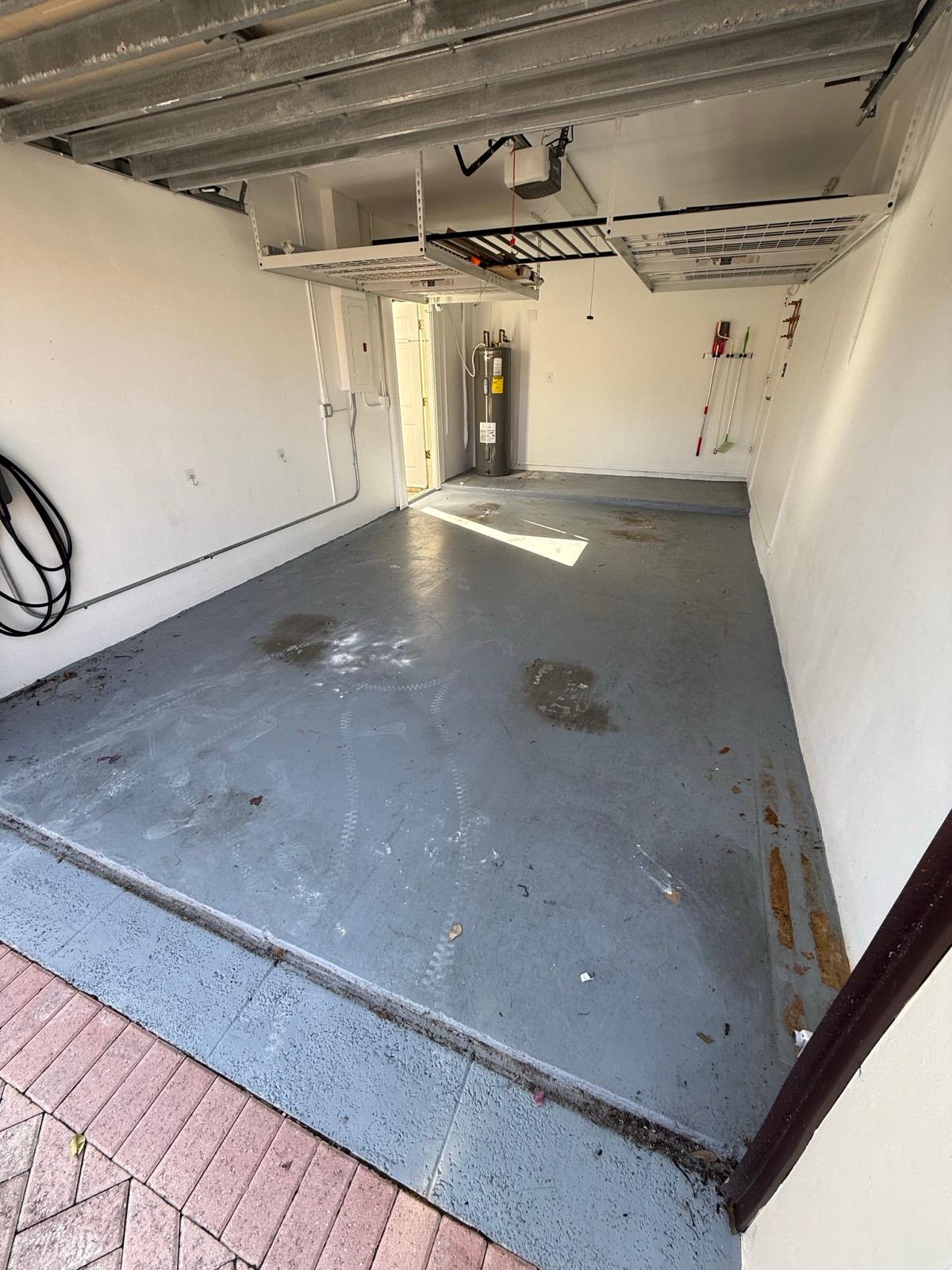 Unfinished concrete garage floor before decorative flake epoxy coating in Parkland, FL