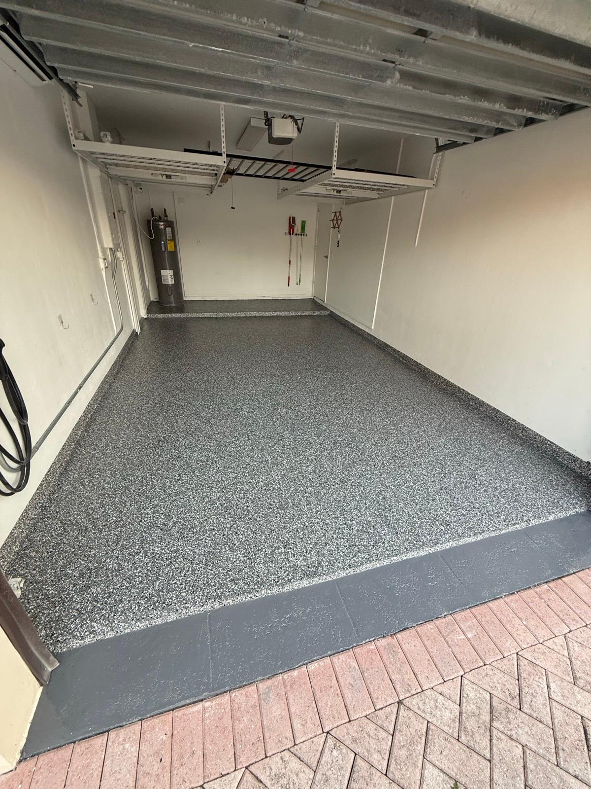 Beige and tan flake epoxy garage floor coating installed by Resin Masters in Wellington, FL